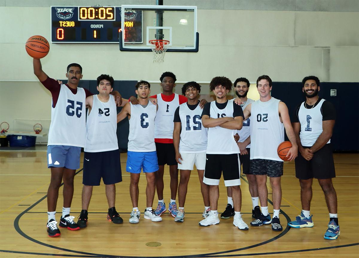 A group of basketball student players on the court